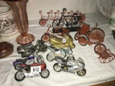 A selection of collectable motorbikes including miniature wire pushbikes