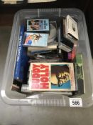 A quantity of miscellaneous music cassettes, videos and books, Abba, Nat King Cole etc.