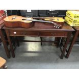 A 2 drawer mahogany side table.