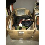 A box containing old gloves, purses etc.