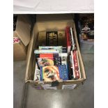 A box of assorted books including Harry Potter.