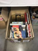 A box of assorted books including Harry Potter.