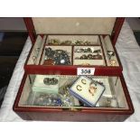 A jewellery box containing earrings & rings etc.