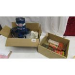 4 Esso motor oil cans (some with contents) and a box of spark plug tins etc.