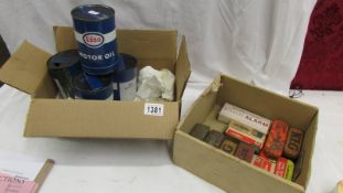 4 Esso motor oil cans (some with contents) and a box of spark plug tins etc.