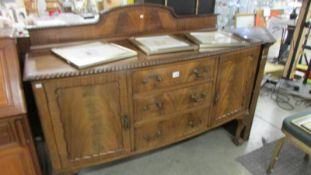 A good quality sideboard on ball and claw feet.