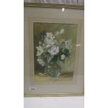 A framed and glazed watercolour of a vase of white flowers, initialled A M S. 84.