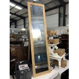 A pine freestanding mirror.