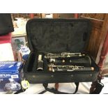 A cased Prelude Conn-Selmer clarinet.