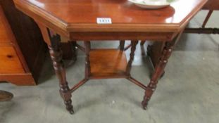 A mahogany octagonal occasional table.