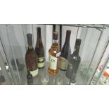 A 1 litre bottle of Bell's whisky, A bottle of Cockburn's special reserve port,