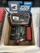 A mixed lot of play worn die cast racing cars, American police car,