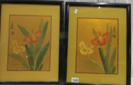A pair of framed and glazed Japanese floral studies.