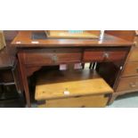 An inlaid writing table with leather inset top.