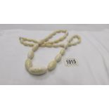 An antique ivory necklace, rethreaded, largest bead is a/f, length 38" (97cm), weight 160 grams.