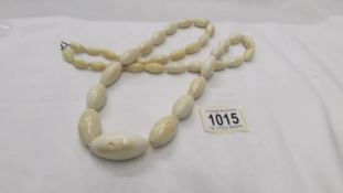 An antique ivory necklace, rethreaded, largest bead is a/f, length 38" (97cm), weight 160 grams.