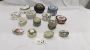 A mixed lot of trinket pots and pill boxes.