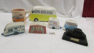 A VW camper money box, a VW camper mug, 2 VW camper egg cups,