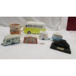 A VW camper money box, a VW camper mug, 2 VW camper egg cups,