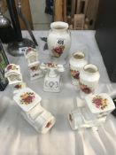 8 rose decorated vases etc.