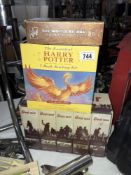 A selection of Harry Potter books and war videos