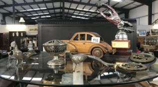 A mixed lot including football trophy, wooden car, horse brasses etc.