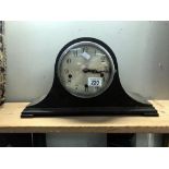 An Edwardian oak mantle clock