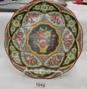 A large hand painted plate.