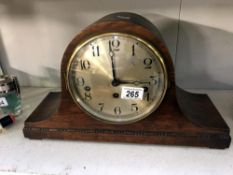 An Edwardian oak mantle clock