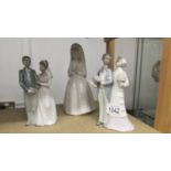 2 Lladro bride and groom figures together with a NAO first communion figure.