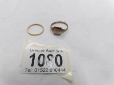 A 22ct gold wedding ring, size O, 1.8 grams and a 9ct gold signet ring, size T, 3 grams.