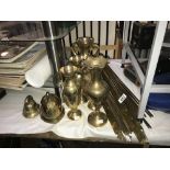 A collection of brassware including stair rods