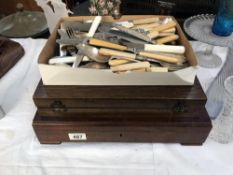 A large quantity of bone and other handled cutlery together with 2 cutlery boxes containing some