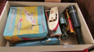 A box of old toys including tin plate 'Wonderjet', tin plate boat, tin plate train etc.