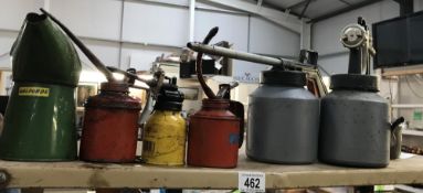 7 old oil cans