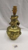 An oriental bronze dragon vase converted to lamp.