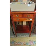 A mahogany 3 drawer side table.