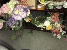 A quantity of tools and artificial flowers