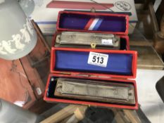 2 boxed super Charmonica harmonica's.