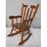 A good dolls rocking chair, 40 cm tall.