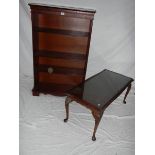 A oak style 4 shelf unit (176 x76 x28 cm) and a glass topped coffee table.