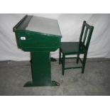 A green painted pine school desk with chair in need of restoration/stripping.