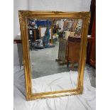 A good gilt framed bevel edged mirror, 75 x 106 cm.