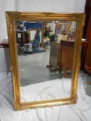 A good gilt framed bevel edged mirror, 75 x 106 cm.