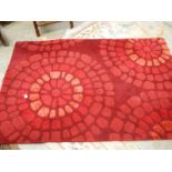 A good quality rug in red, 183 x 122cm.