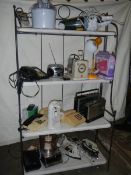 A mixed lot of electric items including can opener, irons, radio, mixer etc.