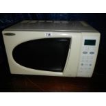 A cream Matsui microwave oven.