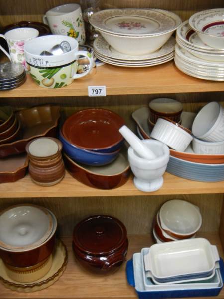 3 shelves of kitchen ceramics, pestle and mortar etc.