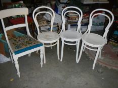 3 bent wood chairs and a white painted chair.