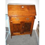 A 1930's oak bureau in good condition.